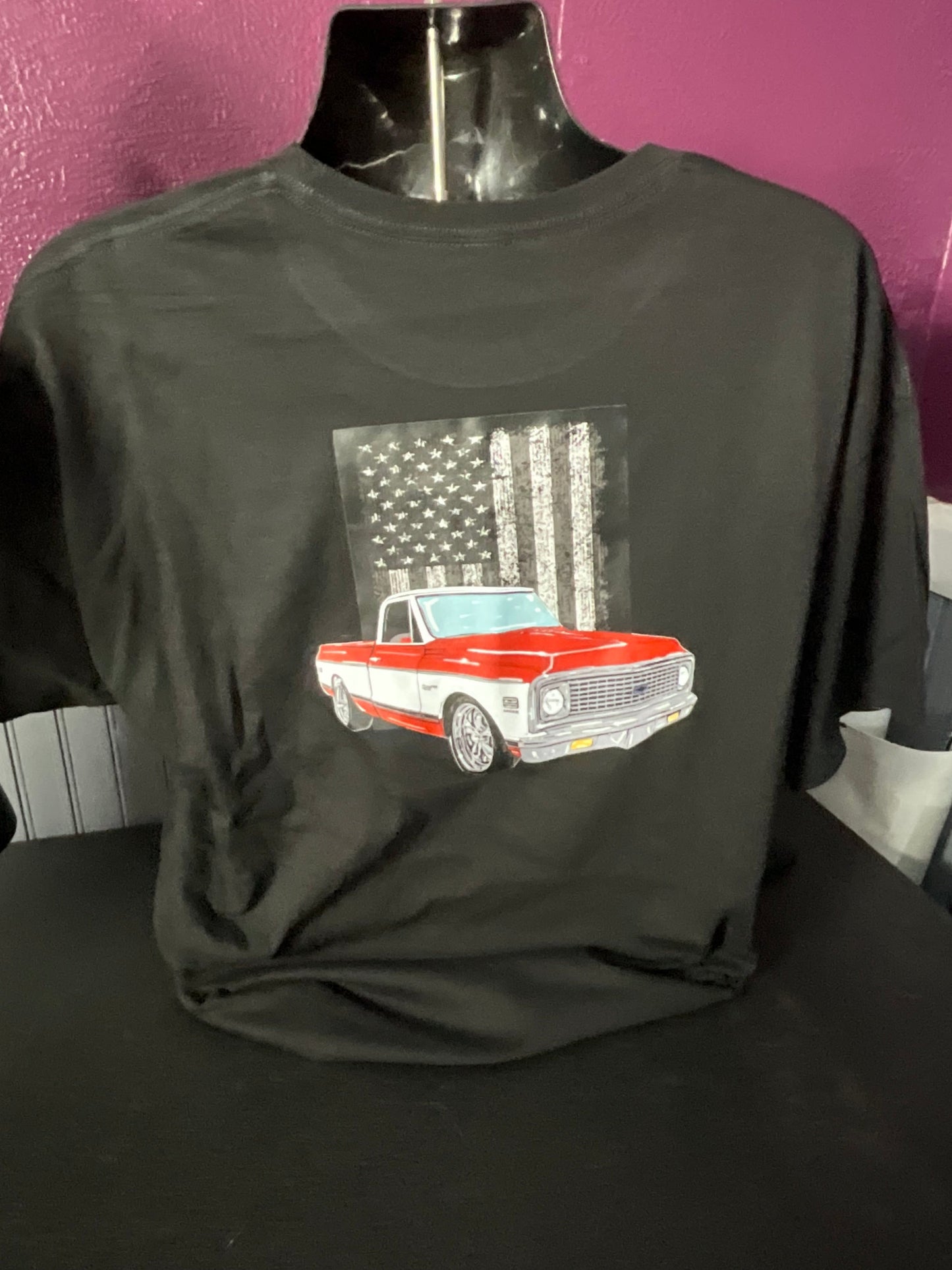 American Pride C10 Tee – Red & White Classic on Flag Backdrop